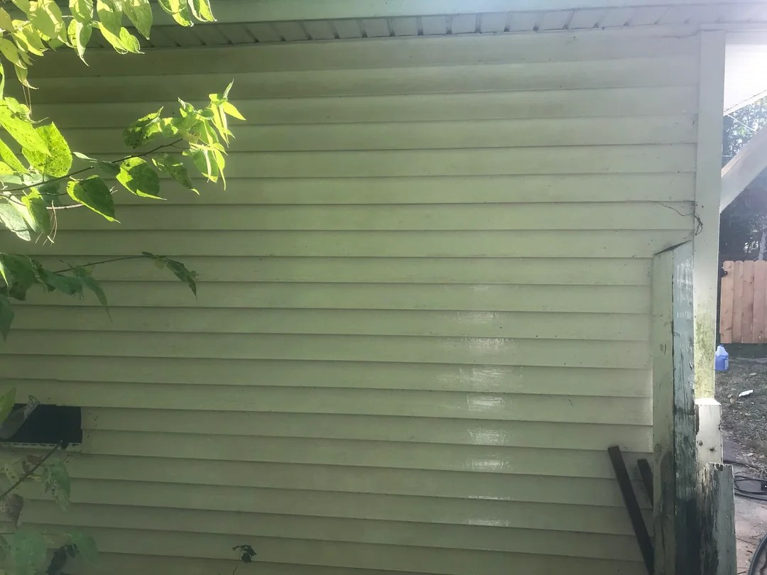 The same vinyl siding, bright and streak-free after soft washing